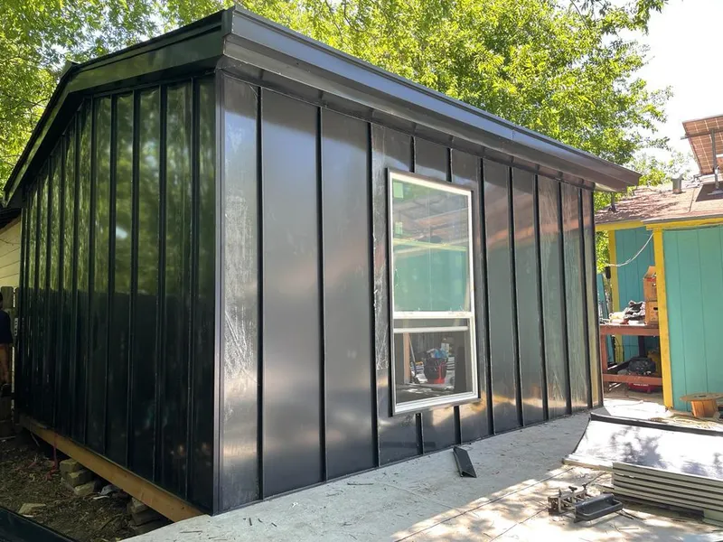 Black standing seam metal wall panels for Roof Inspection in Long Lake